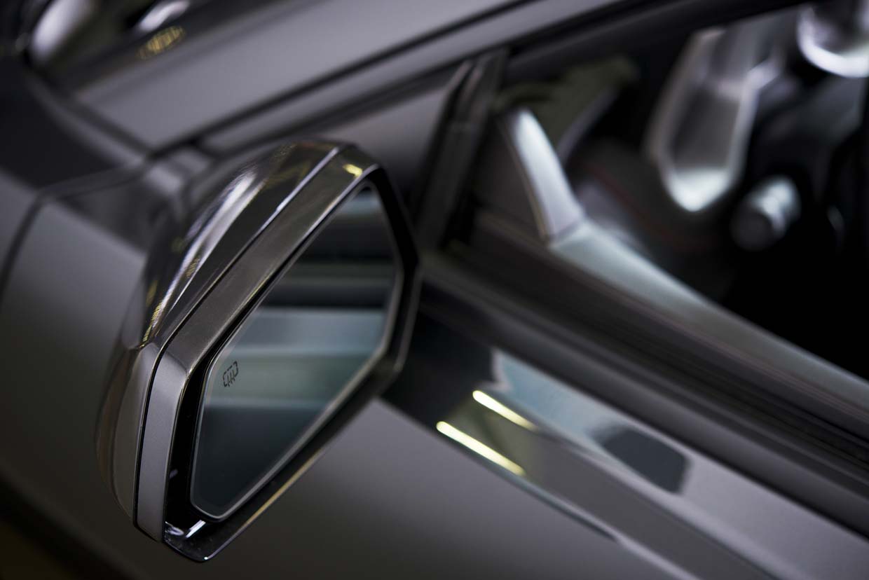 image showing a heated car wing mirror where electrically conductive tape would be used for bonding