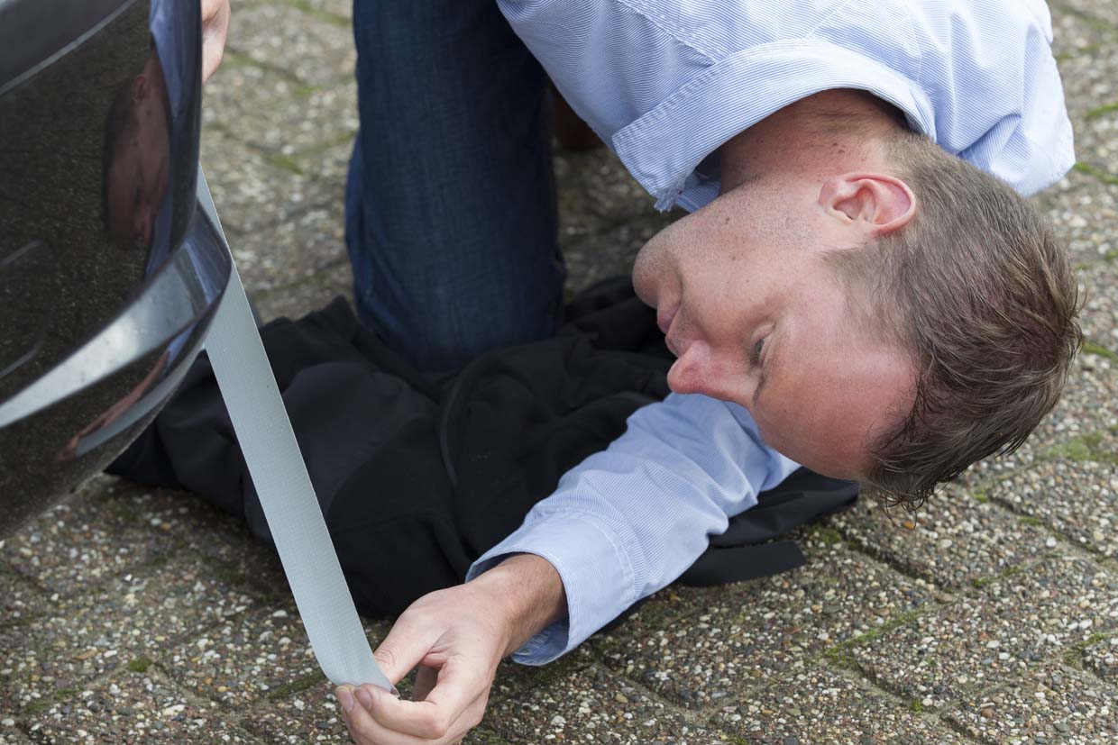 image of cloth tape being used for temporary repair